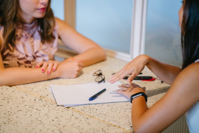 Woman discussing loan process with lender